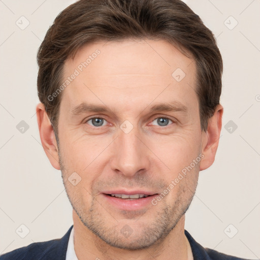 Joyful white adult male with short  brown hair and grey eyes