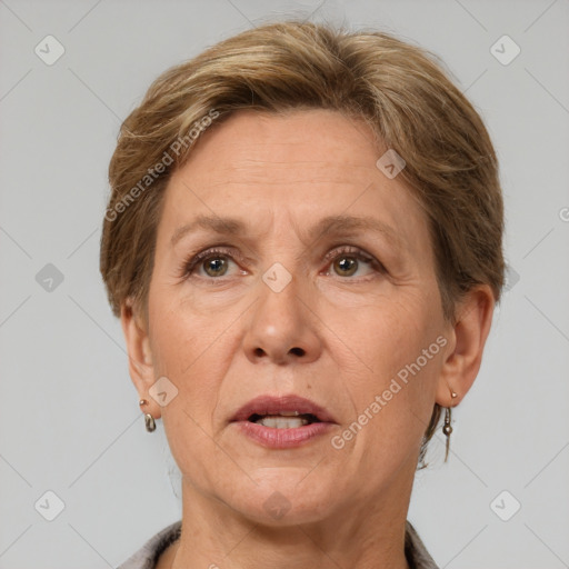 Joyful white adult female with short  brown hair and grey eyes