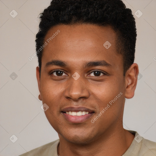 Joyful black young-adult male with short  brown hair and brown eyes