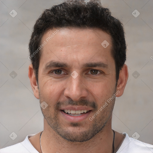 Joyful white young-adult male with short  black hair and brown eyes