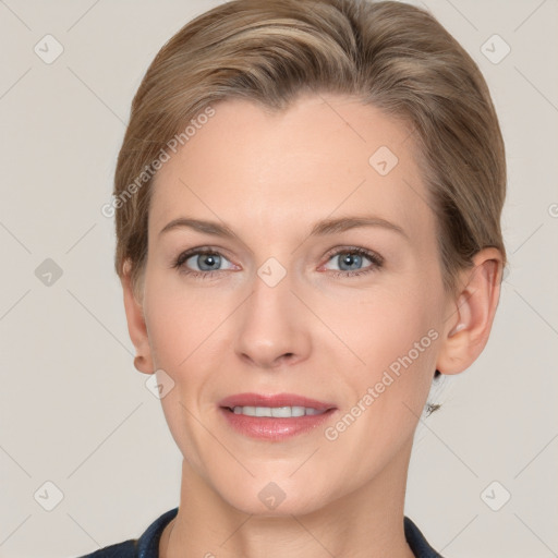 Joyful white young-adult female with short  brown hair and grey eyes