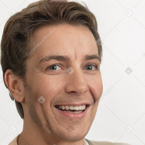 Joyful white adult male with short  brown hair and grey eyes