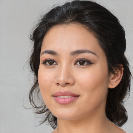 Joyful white young-adult female with medium  black hair and brown eyes