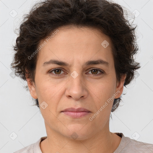 Joyful white adult female with short  brown hair and brown eyes