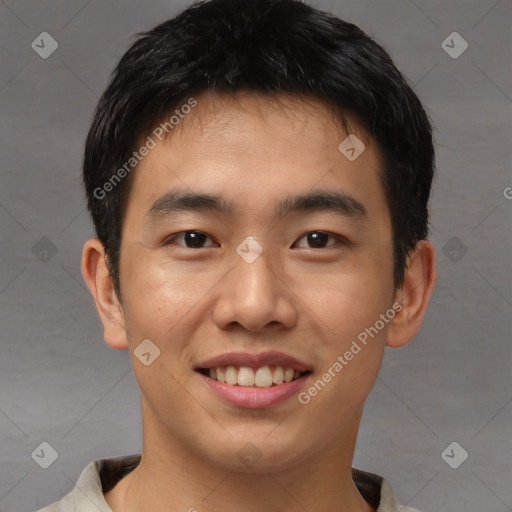 Joyful asian young-adult male with short  brown hair and brown eyes