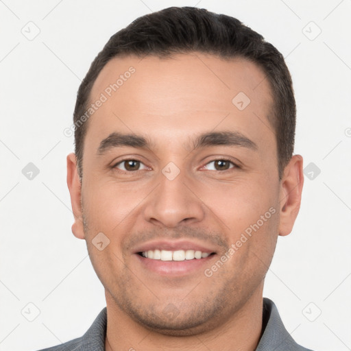 Joyful white young-adult male with short  brown hair and brown eyes