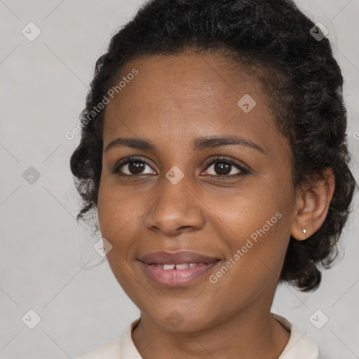 Joyful black young-adult female with medium  brown hair and brown eyes