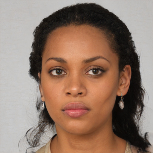 Neutral black young-adult female with long  black hair and brown eyes