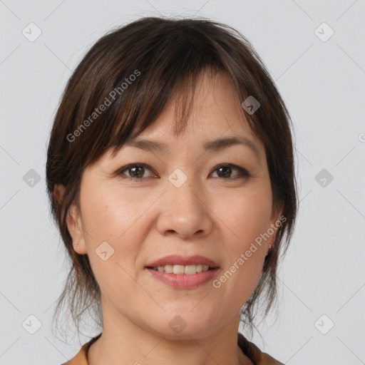 Joyful white adult female with medium  brown hair and brown eyes