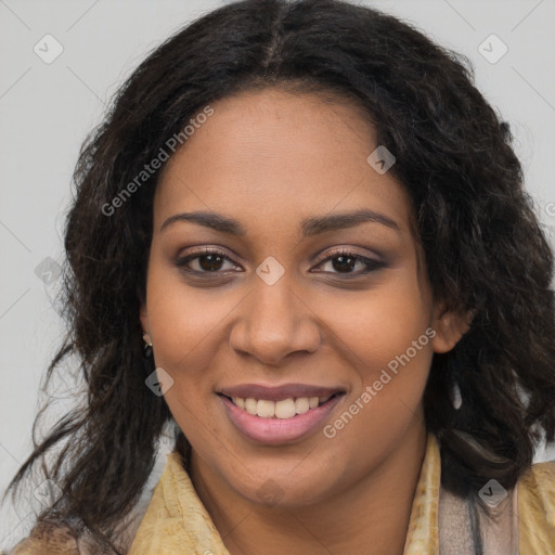 Joyful black young-adult female with long  brown hair and brown eyes