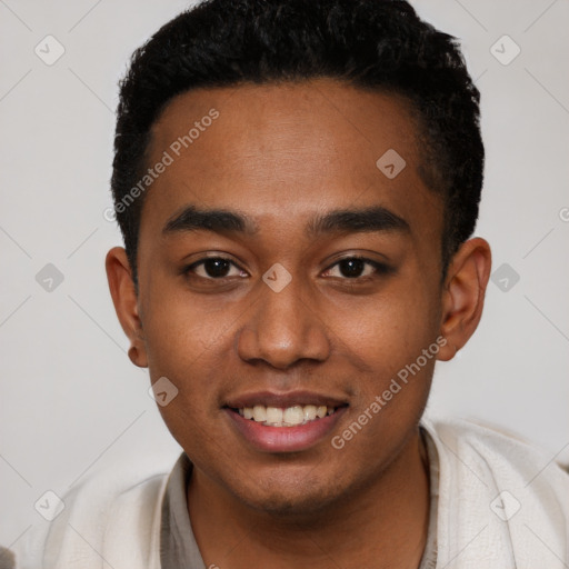 Joyful black young-adult male with short  black hair and brown eyes