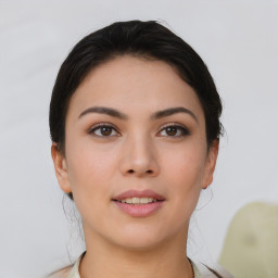 Joyful asian young-adult female with short  brown hair and brown eyes