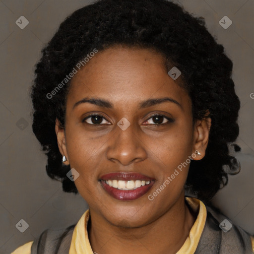 Joyful black young-adult female with long  brown hair and brown eyes