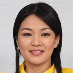 Joyful asian young-adult female with medium  brown hair and brown eyes