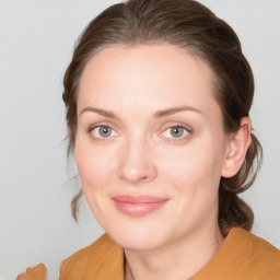 Joyful white young-adult female with medium  brown hair and blue eyes