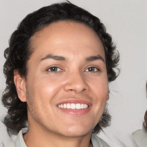 Joyful white young-adult male with medium  brown hair and brown eyes