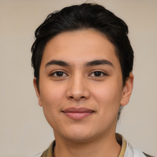 Joyful latino young-adult female with short  brown hair and brown eyes