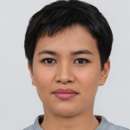 Joyful asian young-adult female with short  black hair and brown eyes