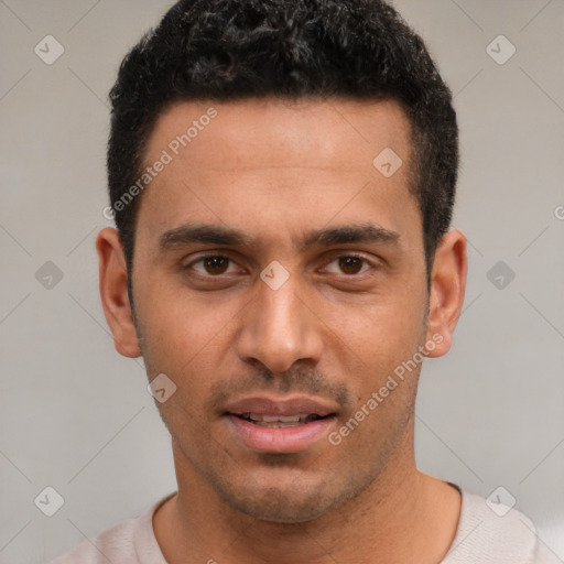 Joyful white young-adult male with short  black hair and brown eyes