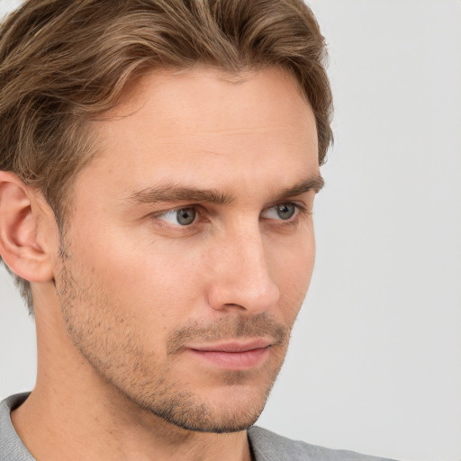 Neutral white young-adult male with short  brown hair and grey eyes