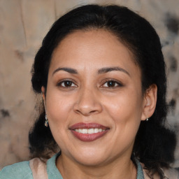 Joyful asian adult female with medium  brown hair and brown eyes