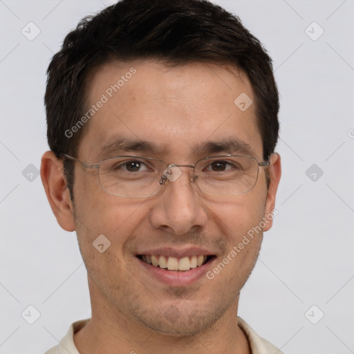 Joyful white adult male with short  brown hair and brown eyes