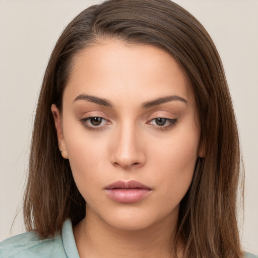 Neutral white young-adult female with long  brown hair and brown eyes