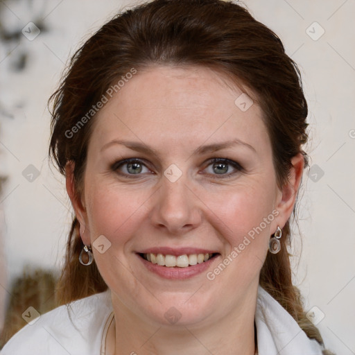 Joyful white young-adult female with medium  brown hair and blue eyes