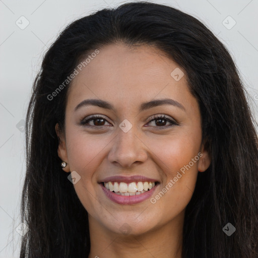 Joyful latino young-adult female with long  brown hair and brown eyes