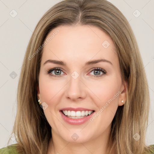 Joyful white young-adult female with medium  brown hair and green eyes