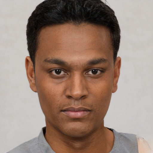 Neutral black young-adult male with short  black hair and brown eyes