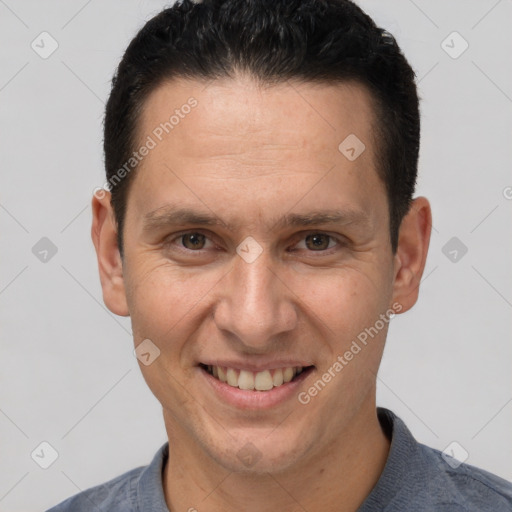 Joyful white adult male with short  brown hair and brown eyes