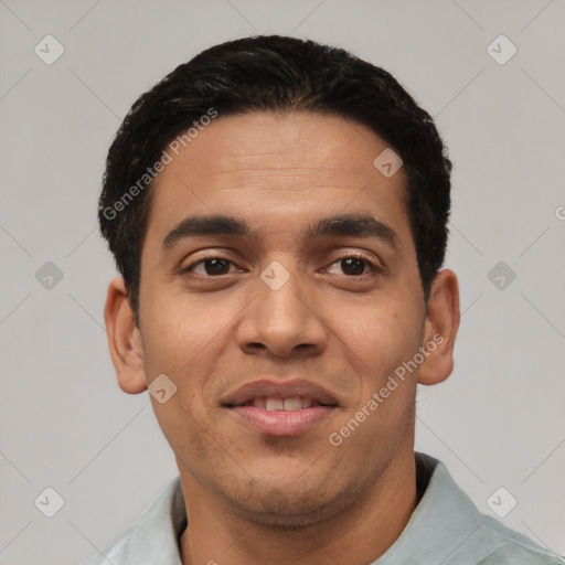 Joyful latino young-adult male with short  black hair and brown eyes