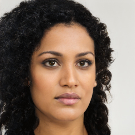Neutral latino young-adult female with long  brown hair and brown eyes