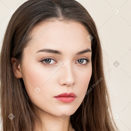 Neutral white young-adult female with long  brown hair and brown eyes