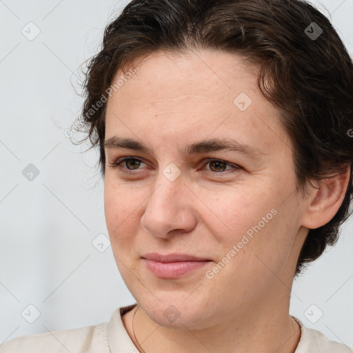 Joyful white adult female with short  brown hair and brown eyes