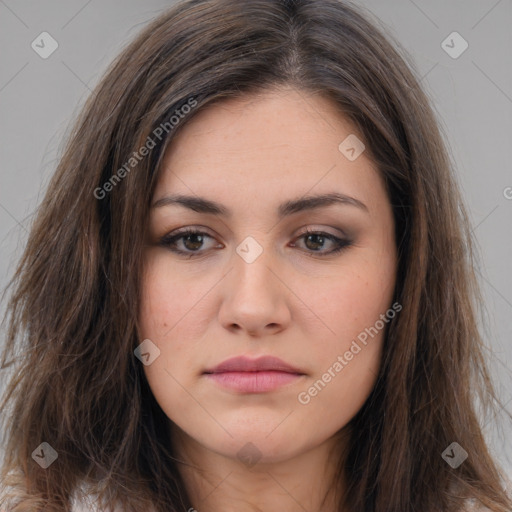 Neutral white young-adult female with long  brown hair and brown eyes