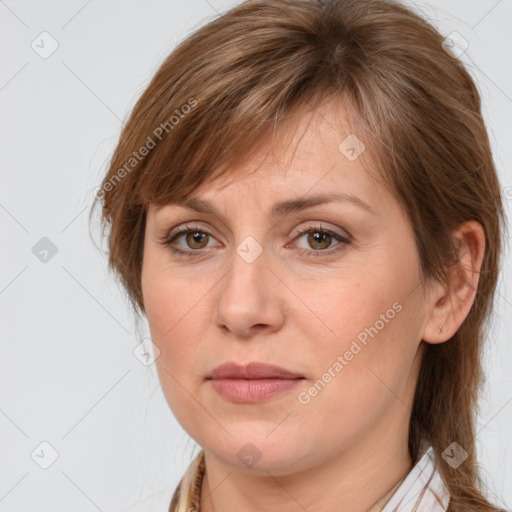 Joyful white adult female with long  brown hair and brown eyes