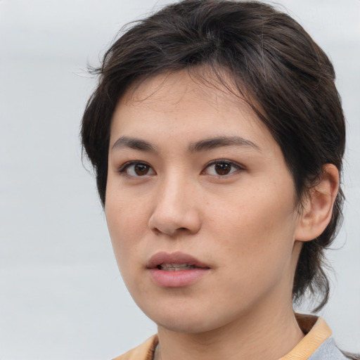 Neutral asian young-adult female with medium  brown hair and brown eyes