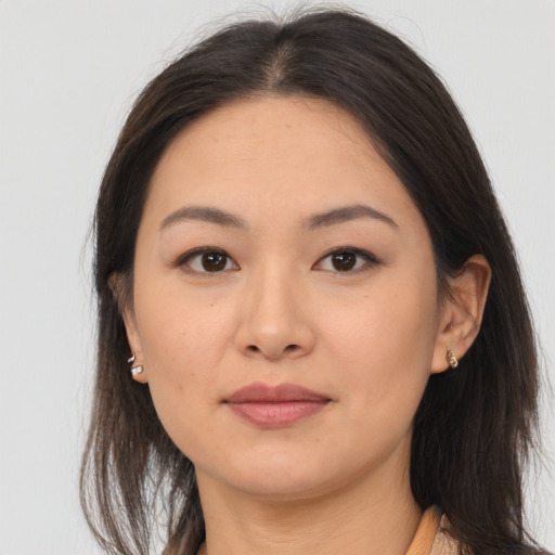 Joyful asian young-adult female with medium  brown hair and brown eyes