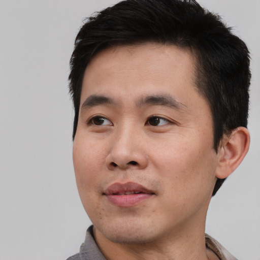Neutral asian young-adult male with short  black hair and brown eyes
