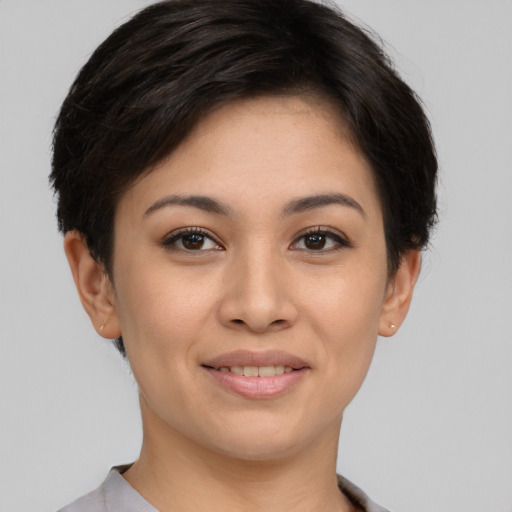 Joyful white young-adult female with short  brown hair and brown eyes