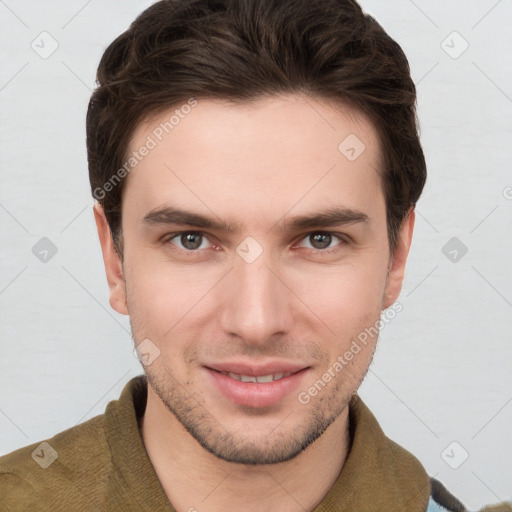 Joyful white young-adult male with short  brown hair and grey eyes