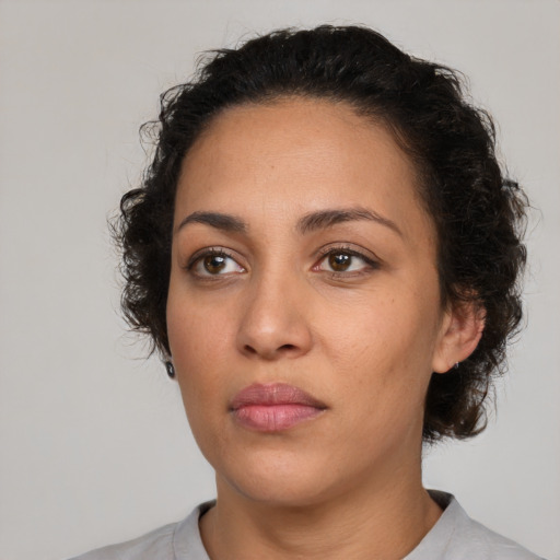 Neutral latino young-adult female with medium  brown hair and brown eyes