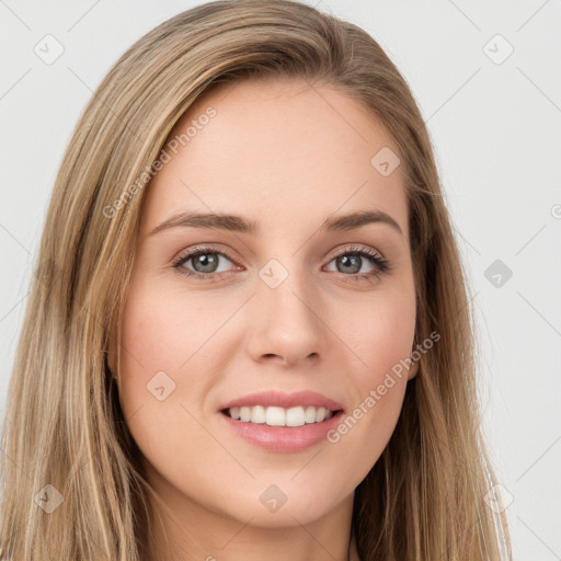 Joyful white young-adult female with long  brown hair and green eyes