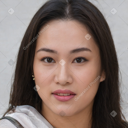 Joyful asian young-adult female with long  brown hair and brown eyes