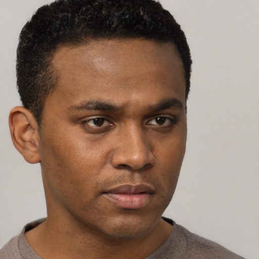 Neutral latino young-adult male with short  brown hair and brown eyes