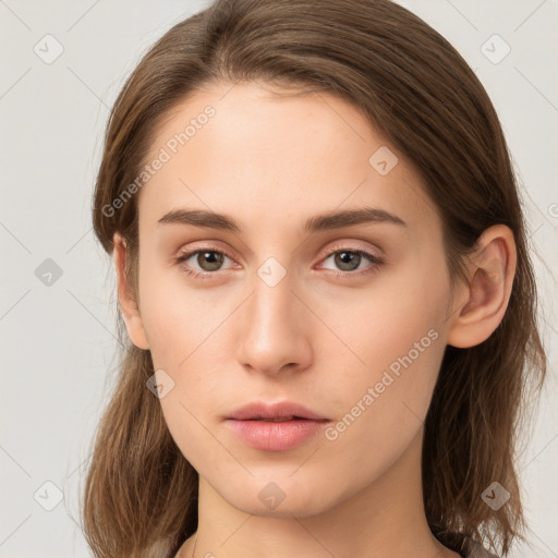 Neutral white young-adult female with long  brown hair and brown eyes