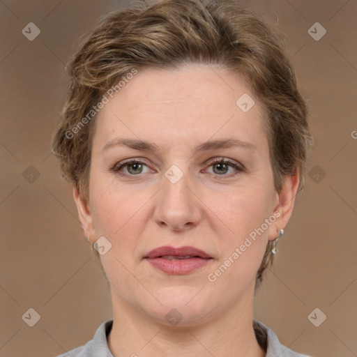 Joyful white adult female with short  brown hair and grey eyes