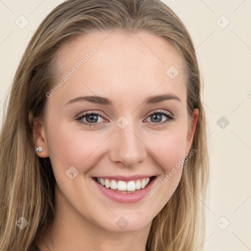 Joyful white young-adult female with long  brown hair and blue eyes